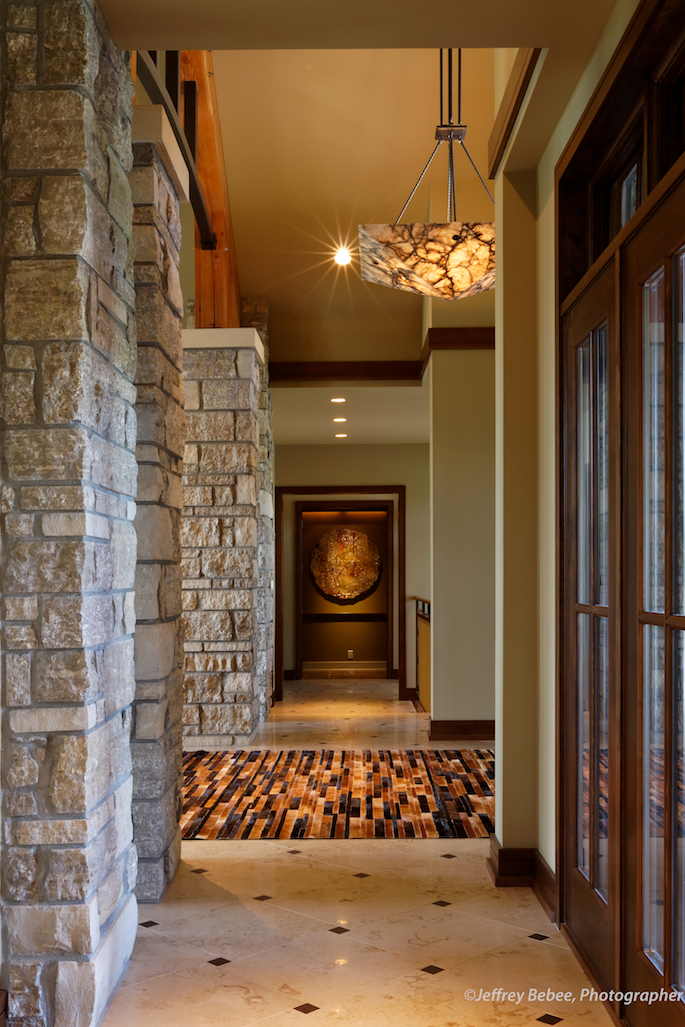 Hallway with stone supports and windows